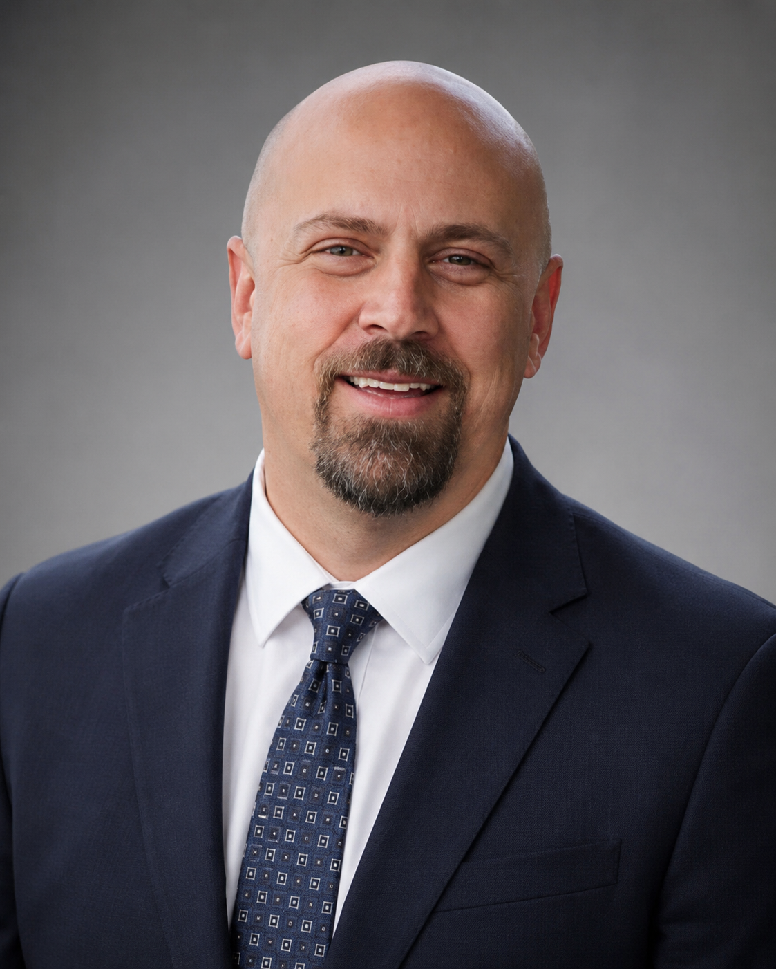 A professional headshot of Schyler Thiessen
