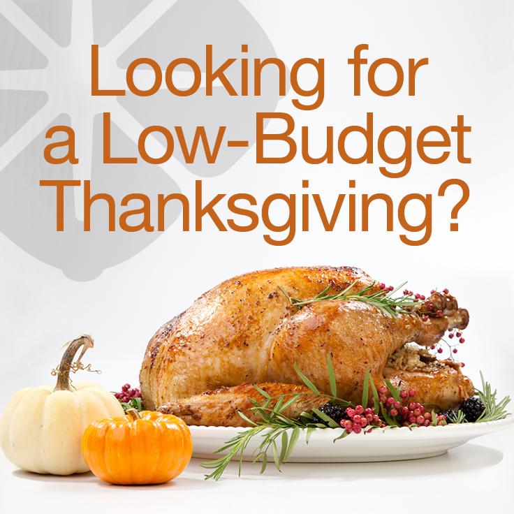 Cooked turkey on a platter with garnish and two pumpkins on the side with the text: Looking for a Low-Budget Thanksgiving?