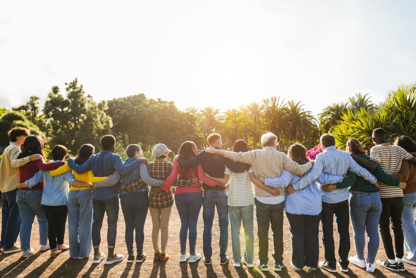 people standing while embracing with their backs to the camera