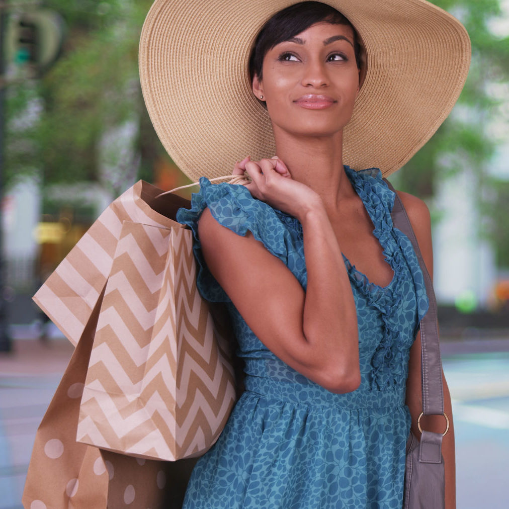 a young woman carries shopping bags in San Francisco's Union Square after applying for a personal loan to fund her needs