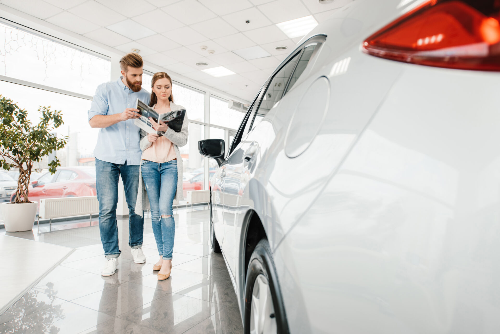 A couple goes car shopping after obtaining a credit union vehicle loan.