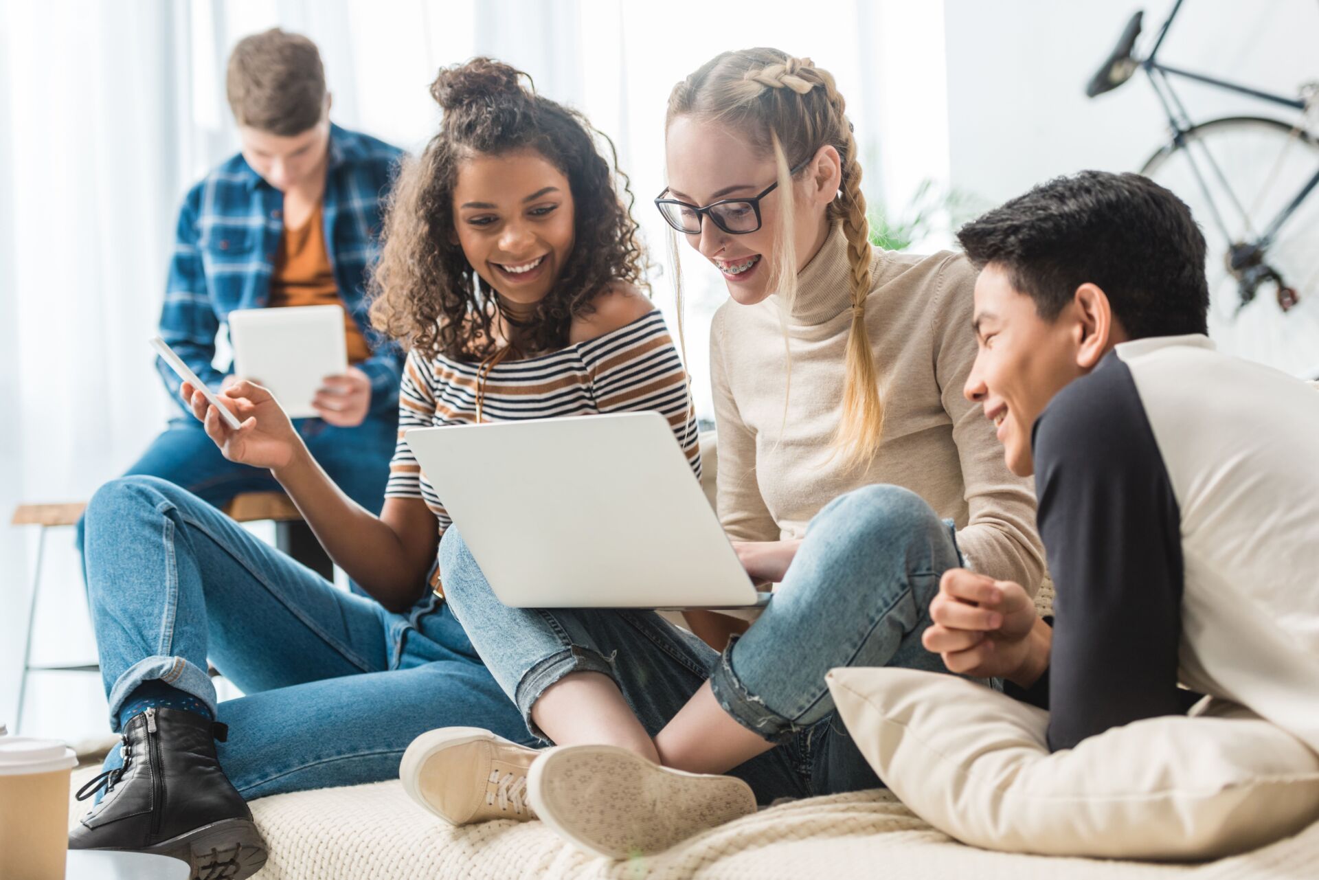 A group of teens discuss saving for their first cars with their youth savings accounts.